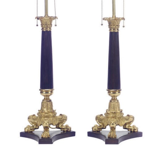 A PAIR OF FRENCH ORMOLU AND BRONZE CANDLESTICKS MOUNTED AS LAMPS,