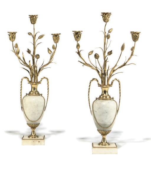 A PAIR OF GILT-METAL MOUNTED MARBLE THREE-LIGHT CANDELABRA