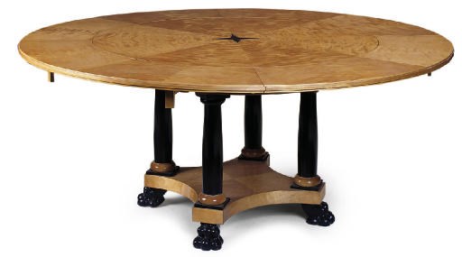 A SATIN BIRCH AND EBONISED DINING TABLE