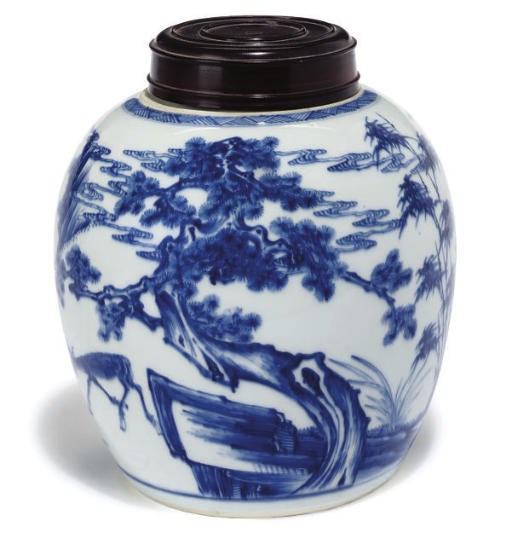 A Chinese blue and white jar and wood cover