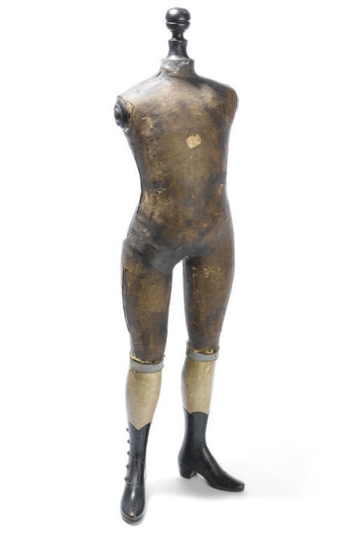 A VICTORIAN PAINTED BEECH AND PAPIER-MÂCHÉ DRESS MAKER'S MODEL