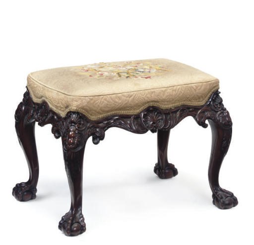 A CARVED MAHOGANY STOOL