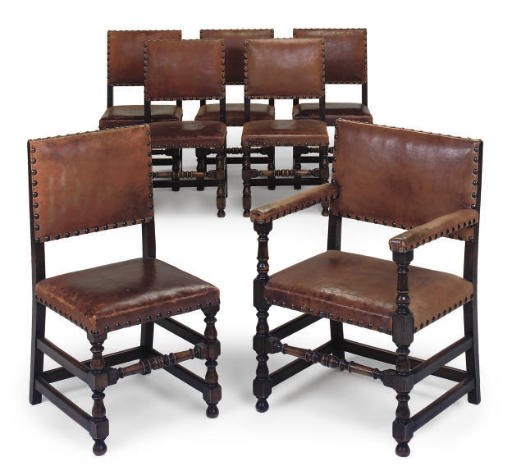 A SET OF SEVEN OAK DINING CHAIRS