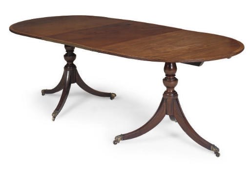 A MAHOGANY MAHOGANY TWIN PEDESTAL DINING TABLE
