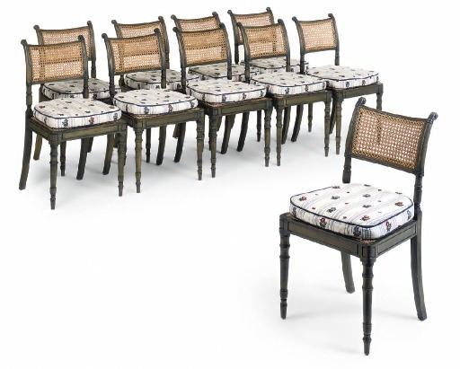 A SET OF TEN GREEN STAINED BEECH AND CANED DINING CHAIRS