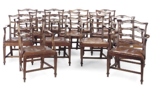 A SET OF FOURTEEN MAHOGANY LADDER BACK DINING CHAIRS