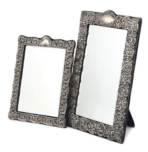 AN EDWARDIAN SILVER DRESSING TABLE MIRROR WITH EASEL BACK,