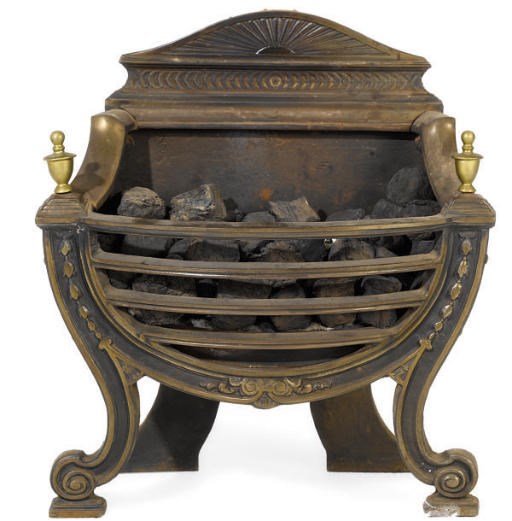 A BRASS MOUNTED CAST-IRON FIREGRATE