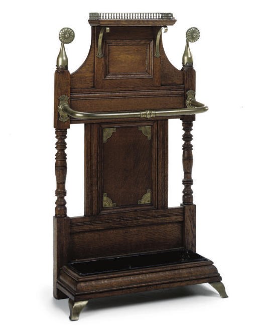 A LATE VICTORIAN BRASS MOUNTED OAK HALLSTAND