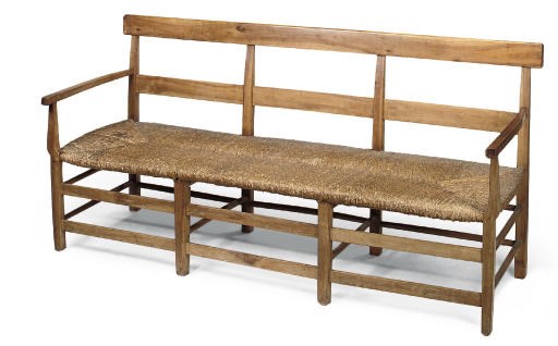 A FRENCH CHERRYWOOD SETTLE