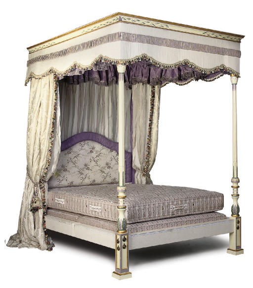 A WHITE PAINTED AND POLYCHROME DECORATED FOUR POSTER BED