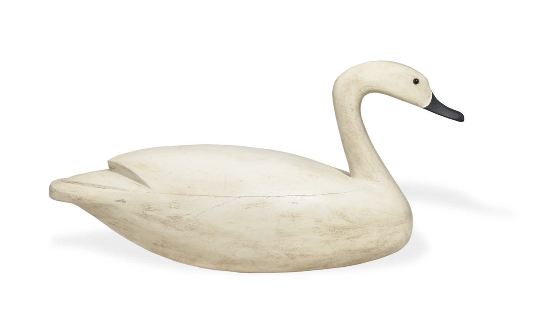 A HOLLOW CARVED SWAN