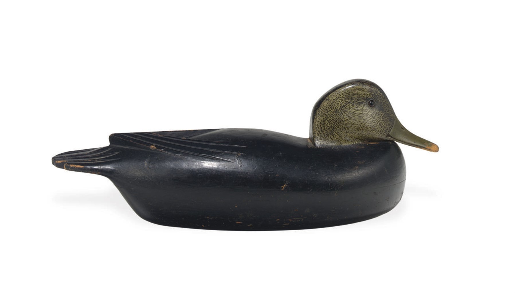 A HOLLOW CARVED BLACK DUCK