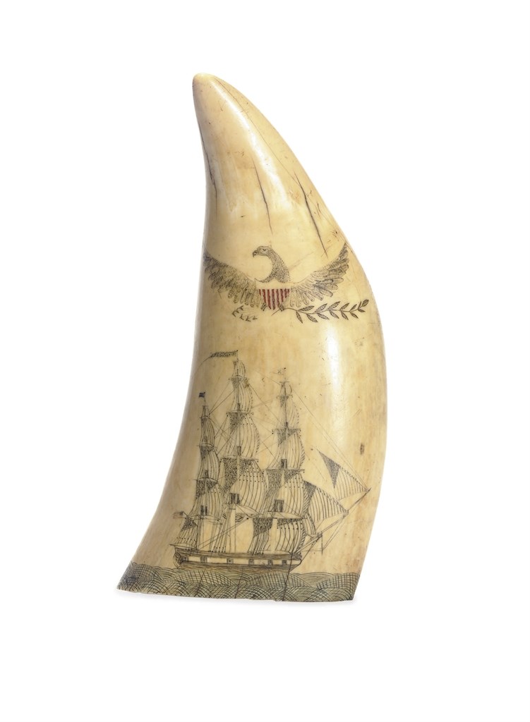 A SCRIMSHAW WHALE TOOTH