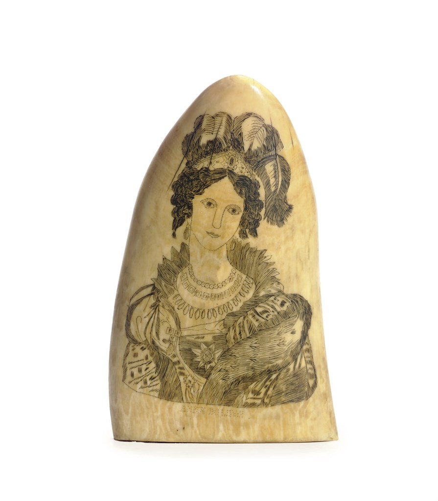 A SCRIMSHAW WHALE TOOTH