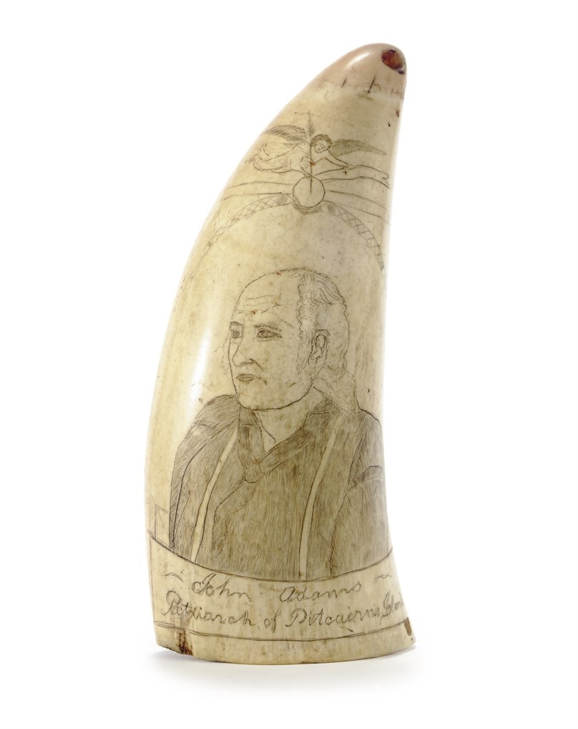 A SCRIMSHAW WHALE TOOTH