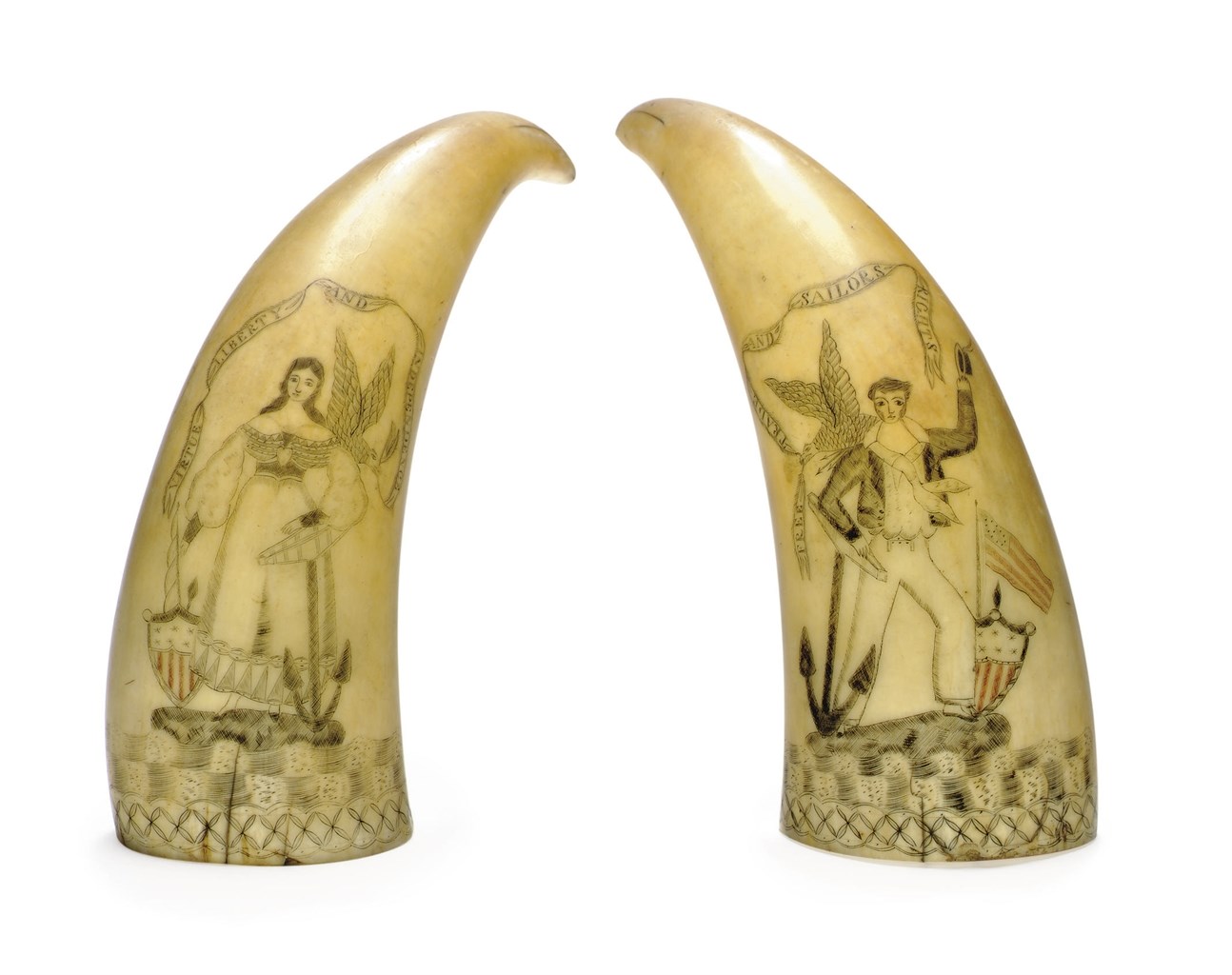 A PAIR OF SCRIMSHAW WHALE TEETH