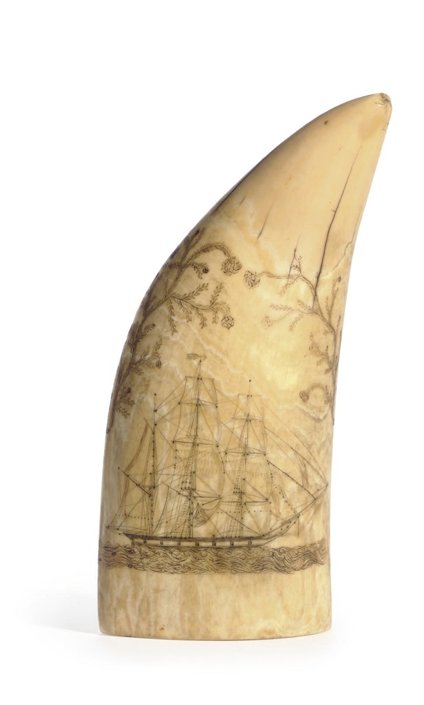 A SCRIMSHAW WHALE TOOTH