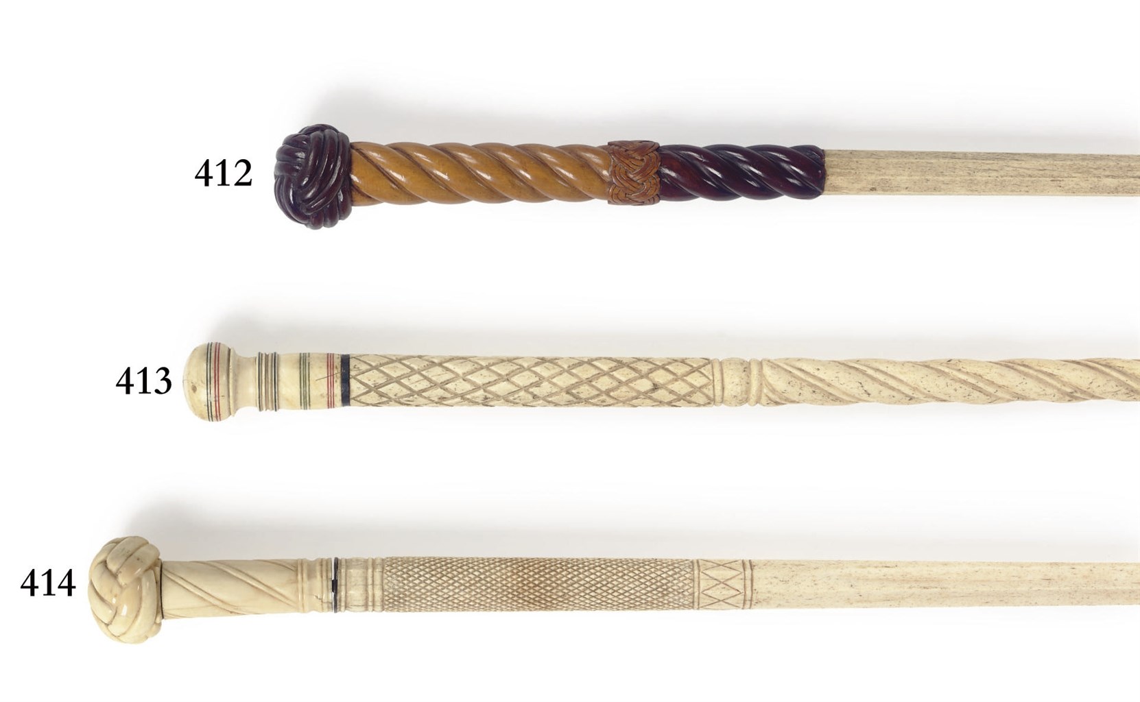 AN IVORY AND WHALEBONE 'MONKEY FIST' WALKING STICK