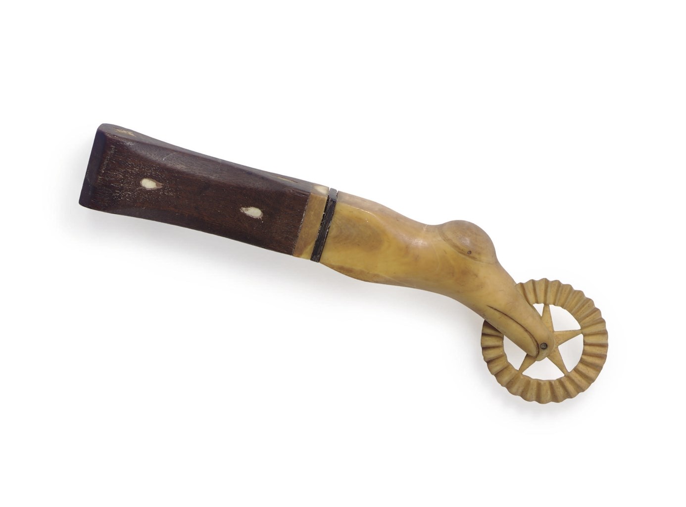 A WHALE IVORY AND MAHOGANY 'ALBATROSS HEAD' JAGGING WHEEL