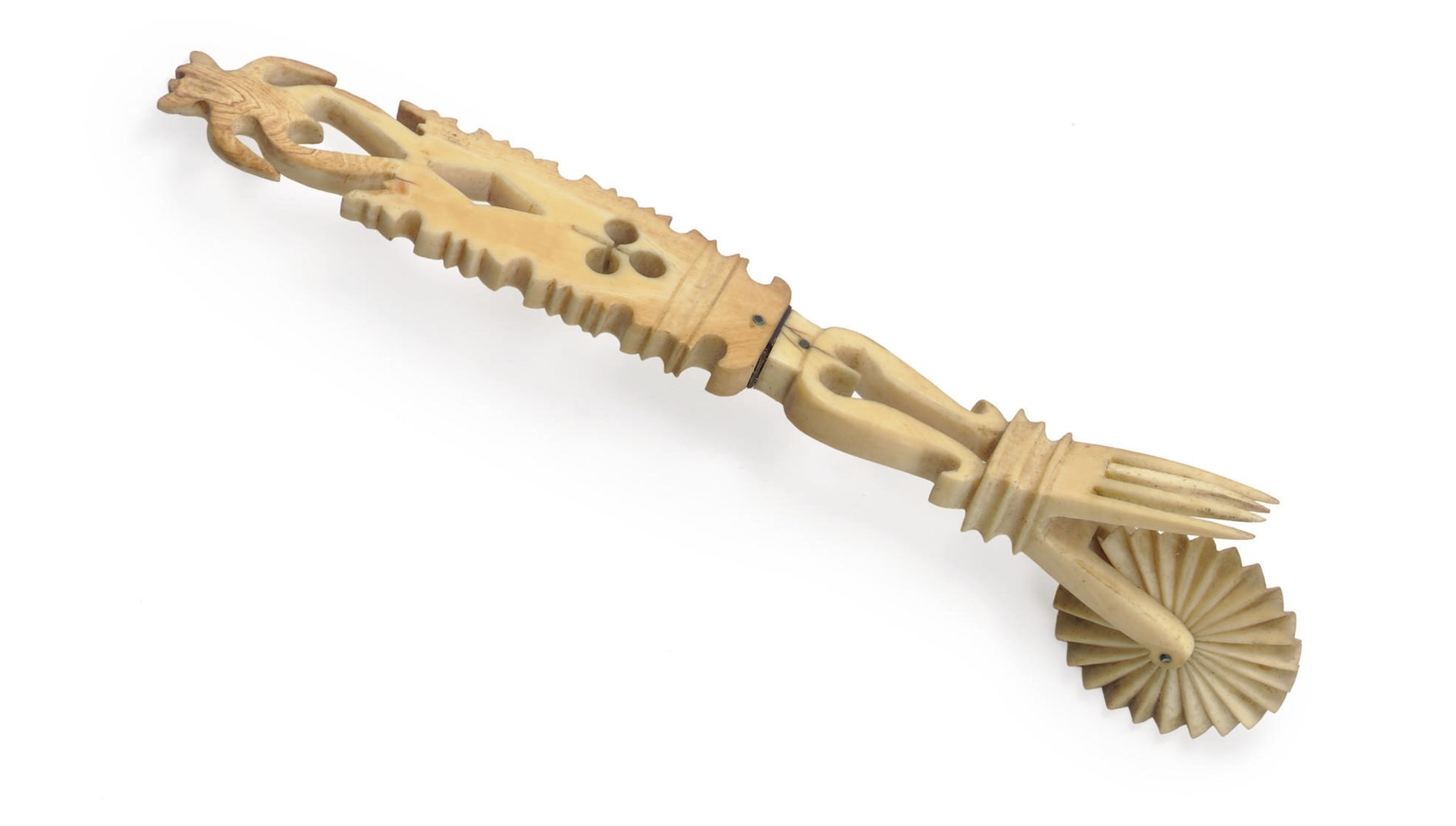 AN IVORY JAGGING WHEEL