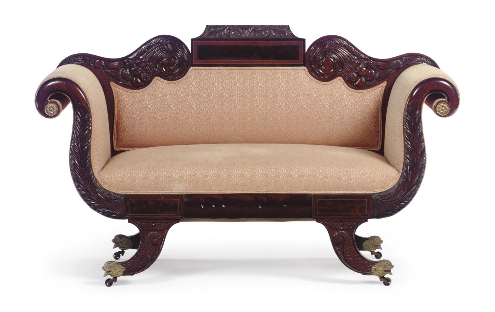 A CLASSICAL CARVED MAHOGANY SOFA