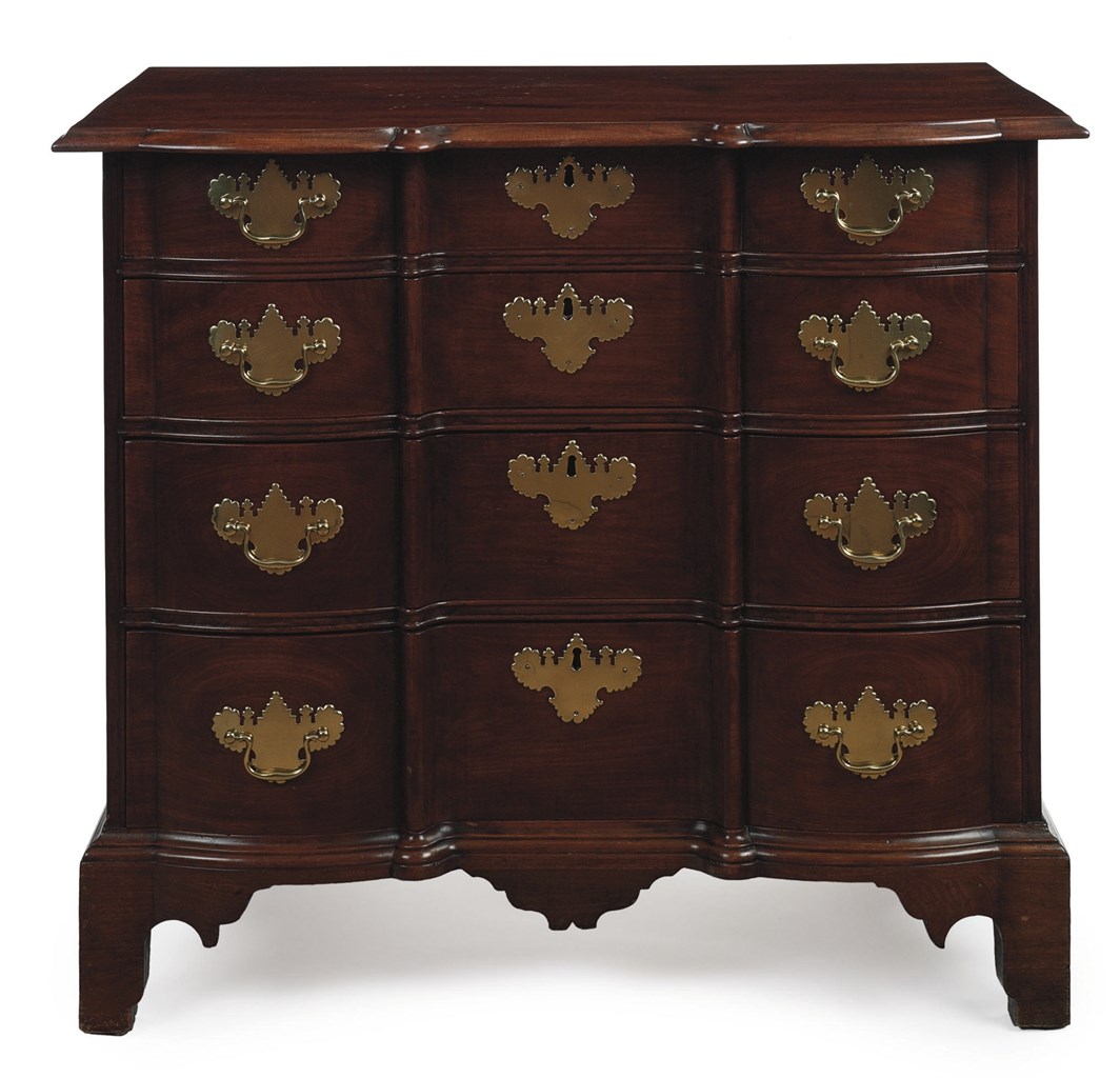 A CHIPPENDALE MAHOGANY BLOCK-FRONT CHEST-OF-DRAWERS