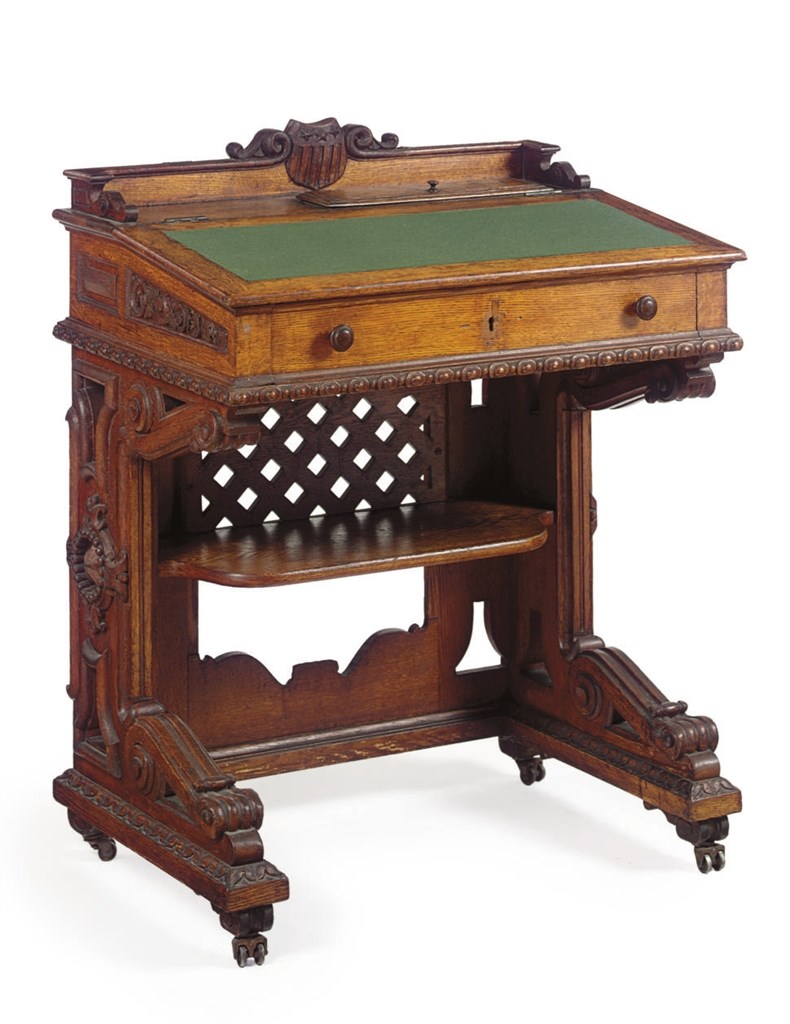 A RENAISSANCE REVIVAL CARVED OAK DESK