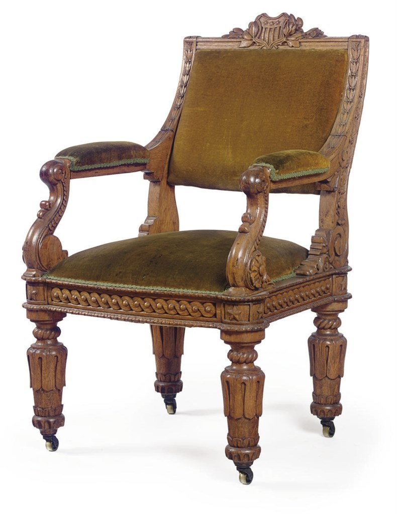 A RENAISSANCE REVIVAL CARVED OAK ARMCHAIR