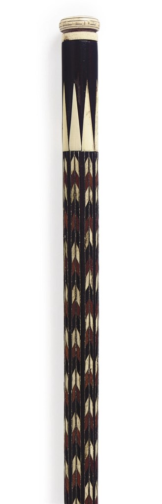 A CARVED BONE AND MAHOGANY WALKING STICK