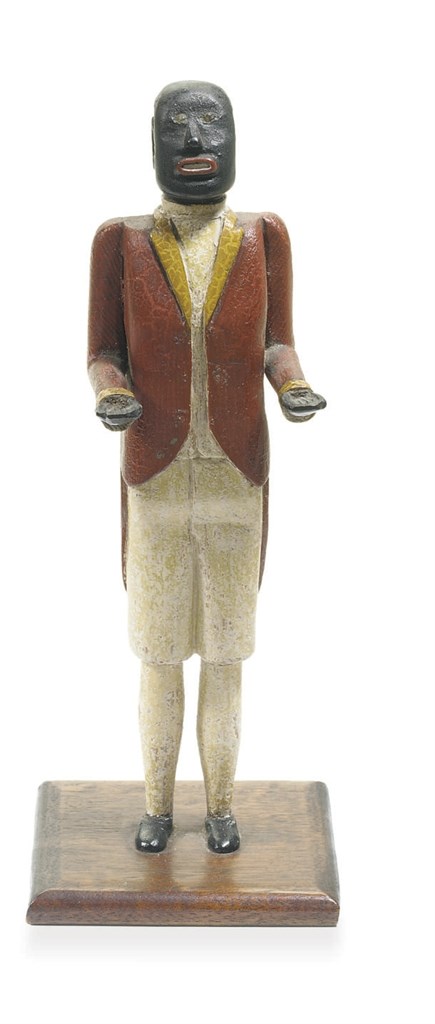 A CARVED AND PAINTED AFRICAN-AMERICAN BUTLER CARD HOLDER
