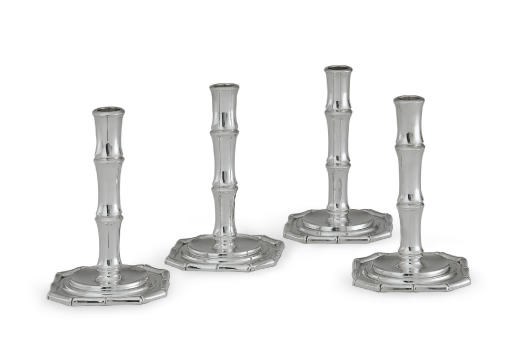 A SET OF FOUR SILVER CANDLESTICKS
