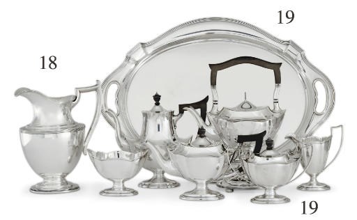 A SILVER SIX-PIECE TEA AND COFFEE SERVICE WITH TRAY