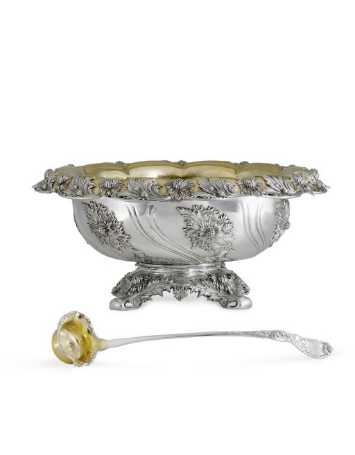 A PARCEL-GILT SILVER PUNCH BOWL AND LADLE