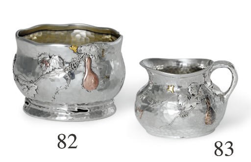 A SILVER AND MIXED-METAL SUGAR BOWL