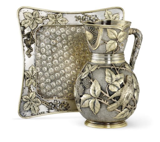 A PARCEL-GILT SILVER-PLATED WATER PITCHER AND STAND