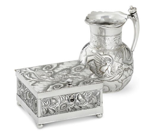 A SILVER-PLATED WATER PITCHER AND BOX