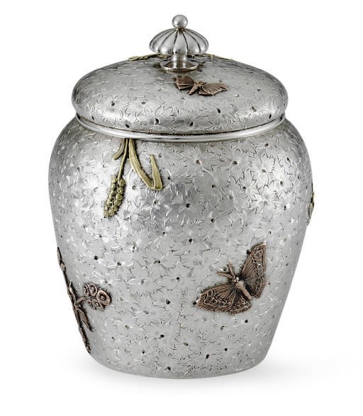 A SILVER AND MIXED-METAL TEA CADDY
