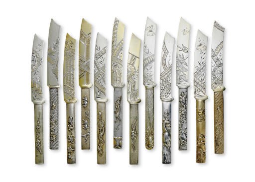 A SET OF TWELVE PARCEL-GILT SILVER DESSERT KNIVES