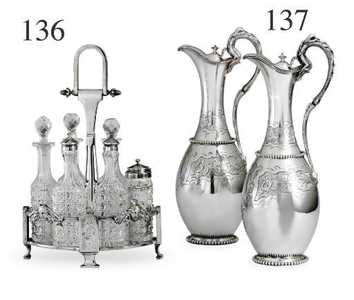 A RARE PAIR OF SILVER CLARET JUGS