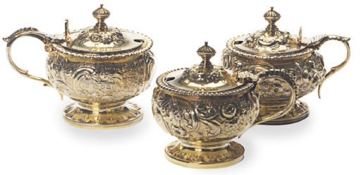 THREE SILVER GILT MUSTARD POTS WITH HINGED COVERS,