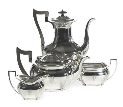 A GEORGE V SILVER FOUR-PIECE TEA AND COFFEE SERVICE AND A GEORGE II COFFEE POT,