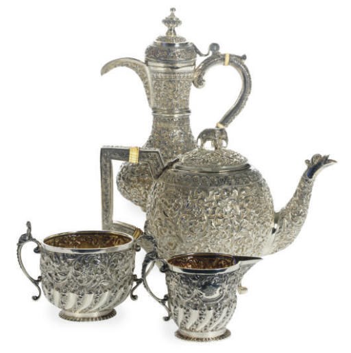 AN ASSEMBLED SILVER FOUR-PIECE TEA SERVICE AND A EWER,**