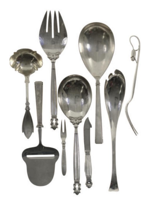 A GROUP OF SILVER SERVING UTENSILS,