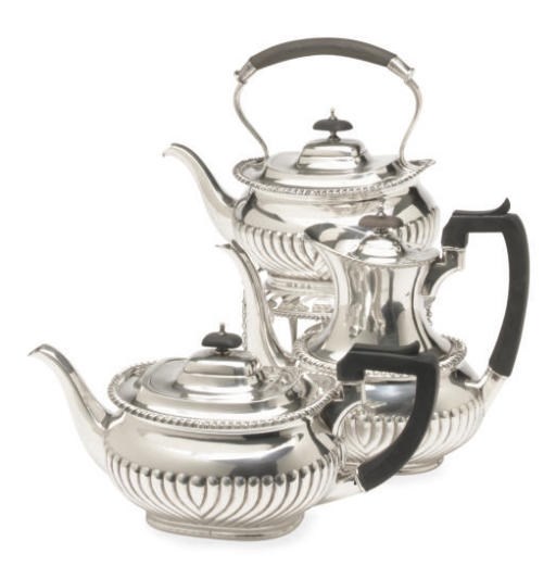 A GEORGE V SILVER THREE-PIECE TEA SERVICE,