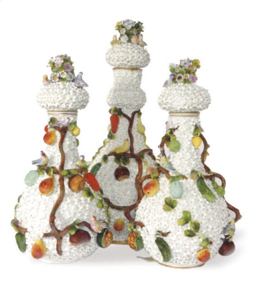 A MEISSEN STYLE PORCELAIN GARNITURE OF SCHNEEBALLEN BOTTLE-VASES AND STOPPERS,