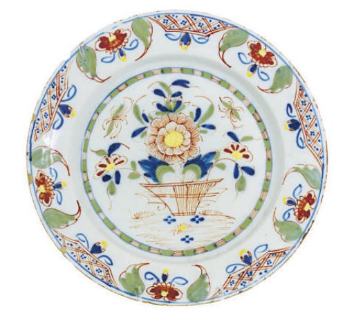 A DUTCH DELFT POLYCHROME-DECORATED TIN-GLAZED CHARGER,