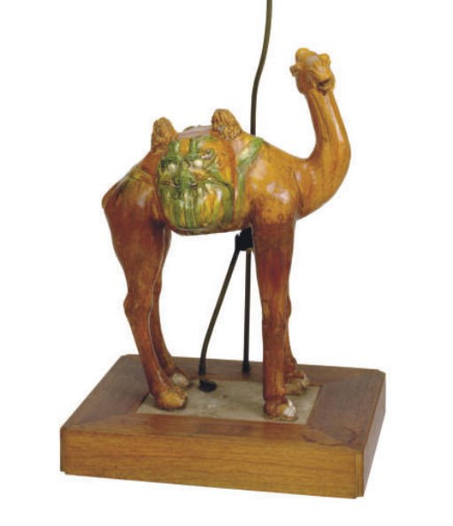 A CHINESE SANCAI GLAZED POTTERY FIGURE OF A BACTRIAN CAMEL AND LAMP STAND,