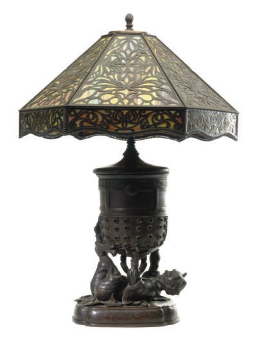 A JAPANESE STYLE BRONZE FIGURAL CENSER MOUNTED AS A LAMP AND SLAG GLASS AND BRONZE SHADE,
