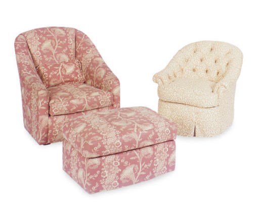 AN UPHOLSTERED LOUNGE CHAIR AND OTTOMAN,